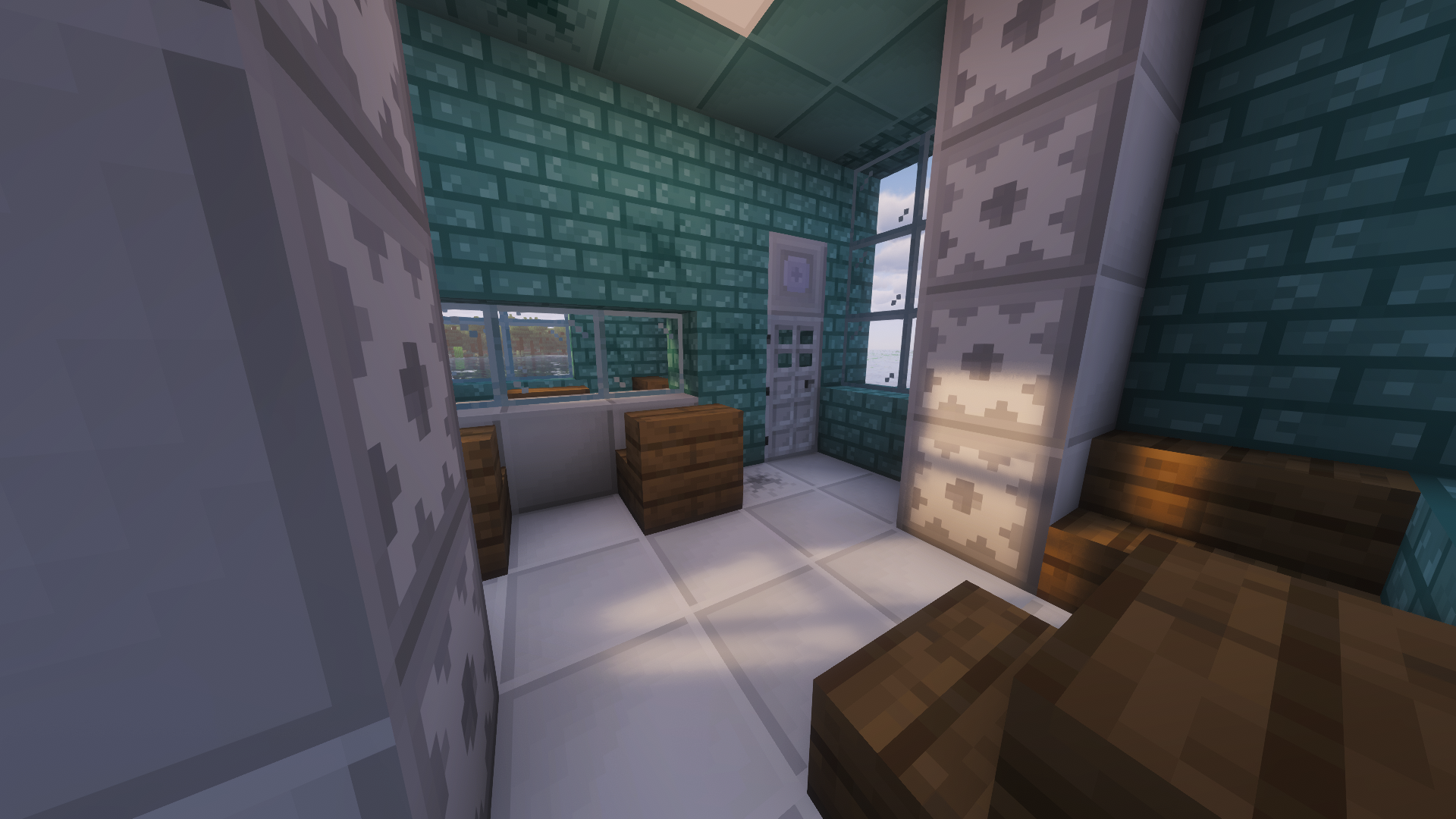 This showcases Teal Bricks, White Large Tiles, Secure Storage Blocks, the Authenticator, and the Variable Light Block with shaders in a building with some vanilla blocks also.